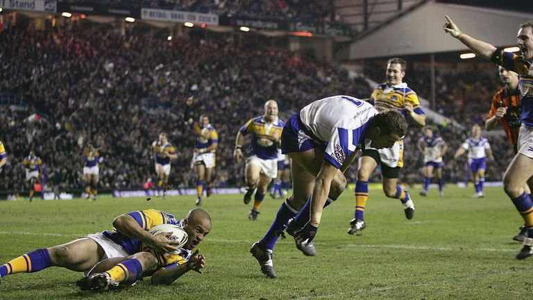 Jamie Jones-Buchanan of Leeds scores the decisive try as Luke Patten of Canterbury fails to end the threat