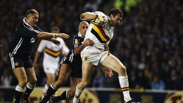 Jamie Peacock of Bradford is tackled by Quentin Pongia of Wigan in 2003