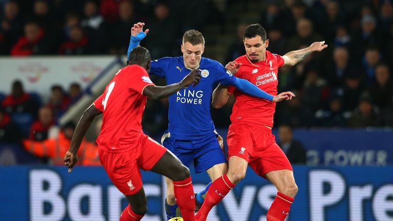 Jamie Vardy (C) of Leicester City controls the ball against Dejan Lovren (R) and Mamadou Sakho (L) of Liverpool