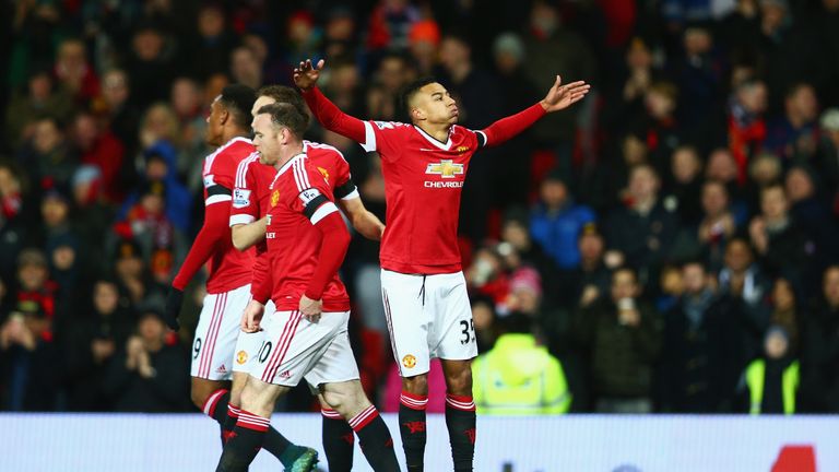 Jesse Lingard (R) of Manchester United celebrates scoring his team's first goal against Stoke