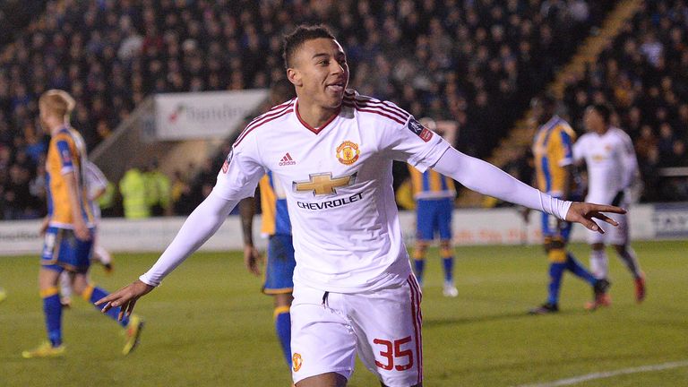 Manchester United's Jesse Lingard celebrates scoring his team's third goal