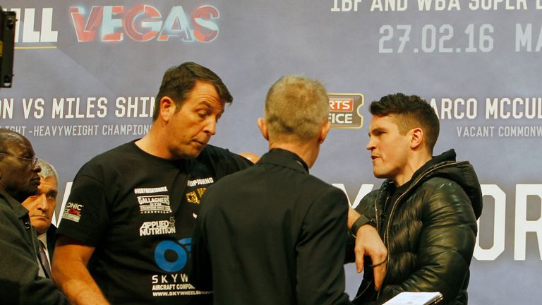 Joe Gallagher (L) and Shane McGuigan clash