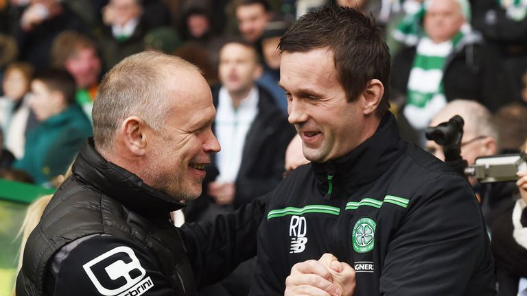 Inverness CT boss John Hughes shakes hands with Celtic manager Ronnie Deila (r)
