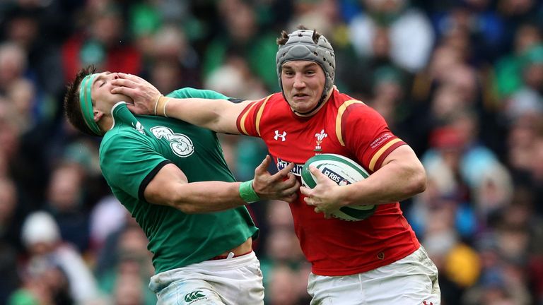 Jonathan Davies hands off CJ Stander during the RBS Six Nations match between Ireland and Wales