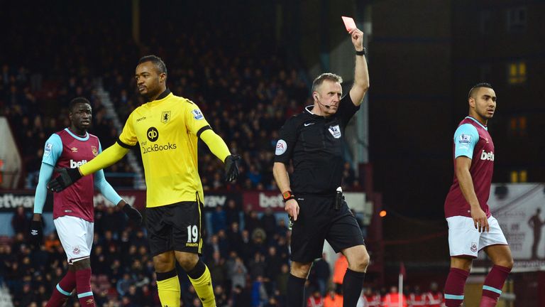 Jordan Ayew of Aston Villa is shown a red card by referee Jonathan Moss against West Ham