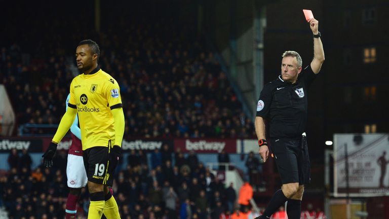 Jonathan Moss red cards Ayew during the first-half at Upton Park