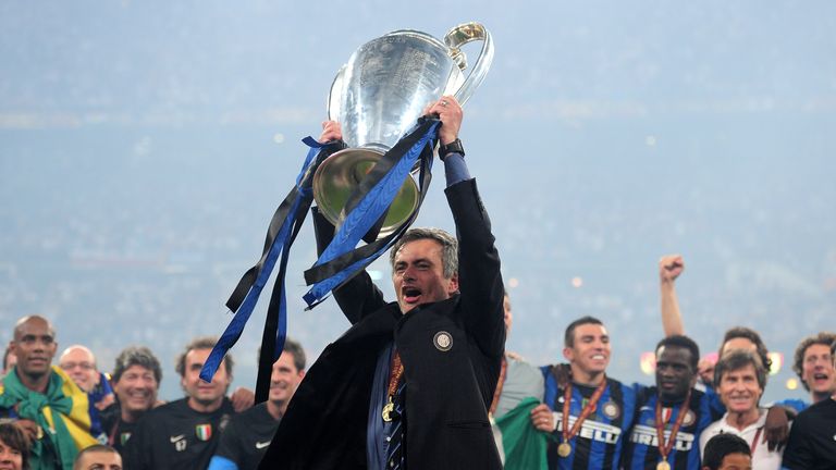 Jose Mourinho the Inter Milan coach holds the trophy aloft after winning the UEFA Champions League