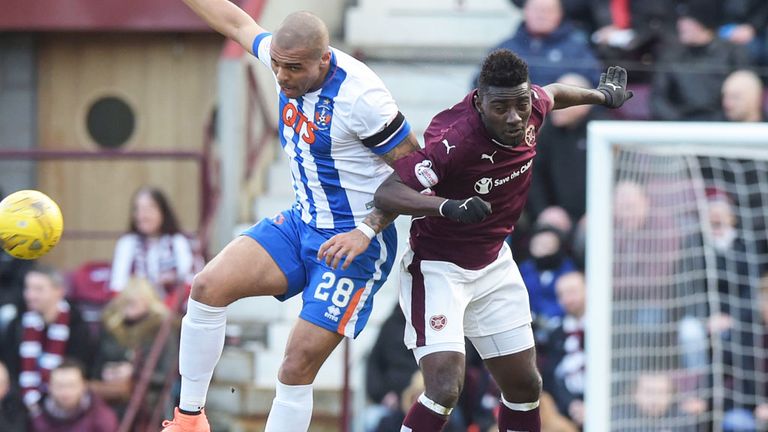 Kilmarnock's Josh Magennis (l) in an aerial challenge with Prince Buaben of Hearts