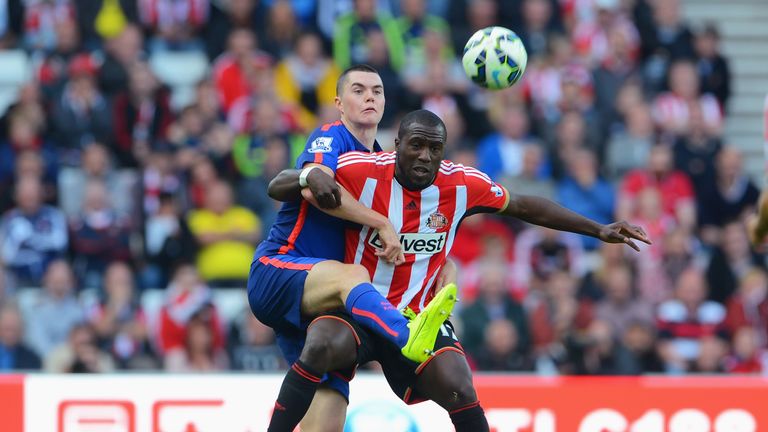 Jozy Altidore of Sunderland is challenged by Michael Keane of Manchester United