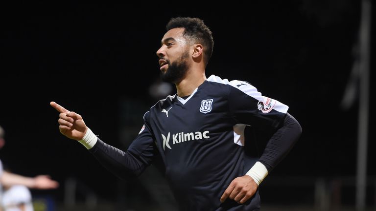 Dundee's Kane Hemmings celebrates having doubled the lead for his side .
