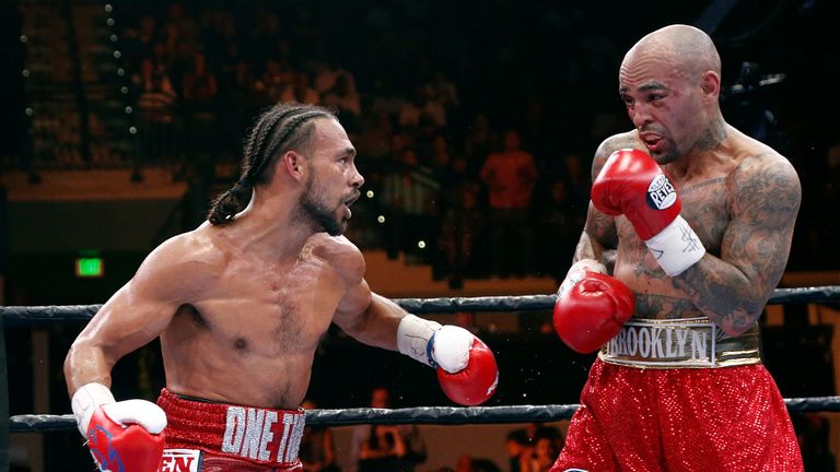Keith Thurman (L) exchanges blows with Luis Collazo during their WBA Welterweight fight on July 11, 2015 at the USF Sun Dome in Tampa