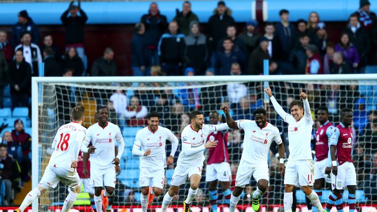 Kolo Toure celebrates with team-mates after scoring Liverpool's sixth goal against Aston Villa