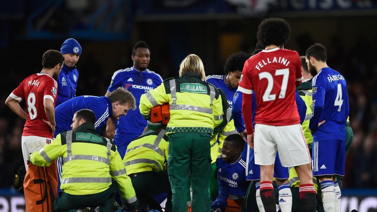 Kurt Zouma is treated after injuring his knee during Chelsea's game against Manchester United
