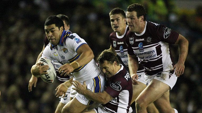 Leeds Kylie Leuluai is tackled by Manly's Matt Orford.