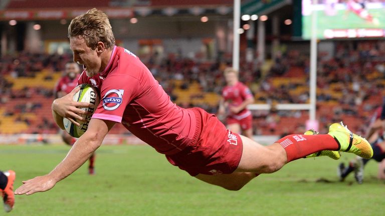 BRISBANE, AUSTRALIA - MAY 15: Lachlan Turner of the Reds dives over to score a try during the round 14 Super Rugby match between the Queensland Reds and th