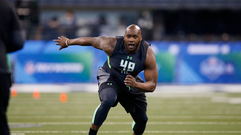 Offensive lineman Laremy Tunsil of Ole Miss participates in a drill during the 2016 NFL Scouting Combine at Lucas Oil Stadi