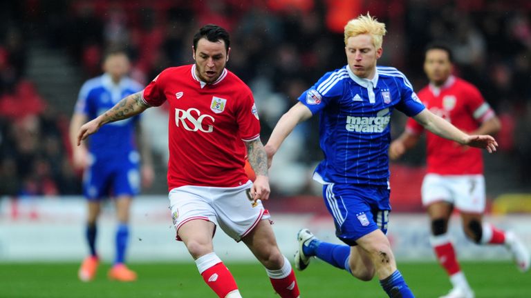 Lee Tomlin of Bristol City is tackled by Ben Pringle of Ipswich Town during the Sky Bet Championship match between B