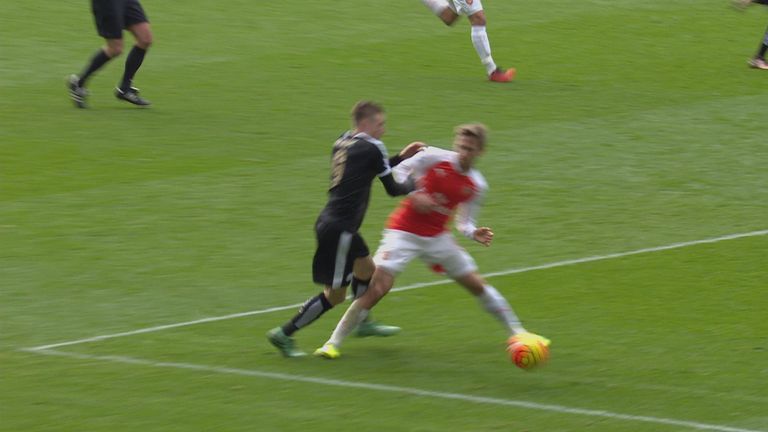 Jamie Vardy is brought down in the area by Nacho Monreal