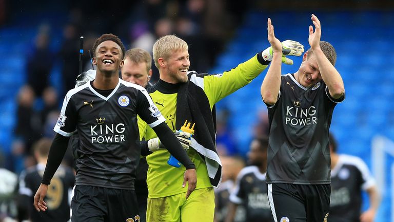 Leicester City's Robert Huth (right), goalkeeper Kasper Schmeichel (centre) and Demarai Gray applaud supporters at the end after win v Manchester City