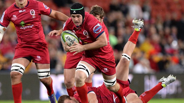 Liam Gill breaks away from the defence during the round 15 Super Rugby match between the Reds and the Sharks