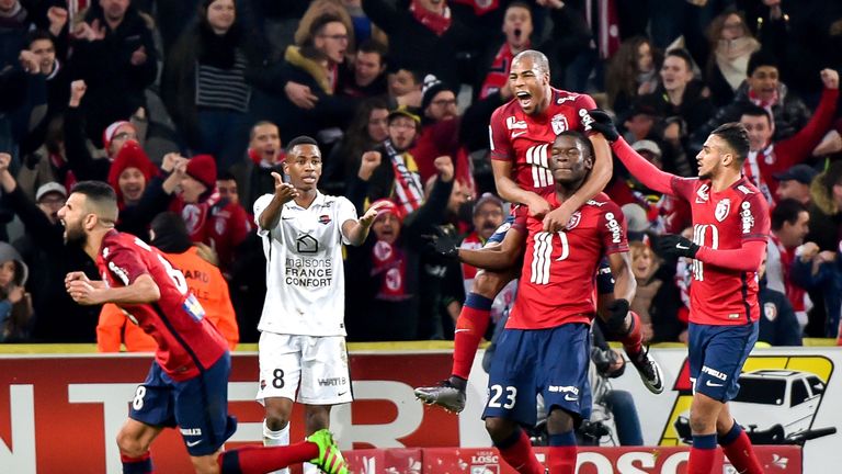 Lille's French defender Bakary Soumaoro (centre) is congratulated after his goal against Caen
