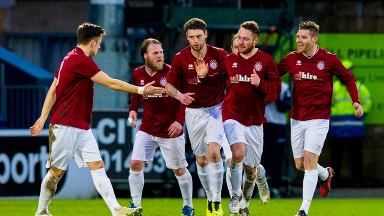 Linlithgow Rose's Ruari MacLennan (centre) celebrates after making it 3-2 against Ross County
