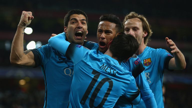 LONDON, ENGLAND - FEBRUARY 23:  Lionel Messi of Barcelona celebrates with Luis Suarez and Neymar