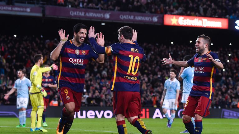 Luis Suarez of FC Barcelona celebrates with his team mate Lionel Messi 