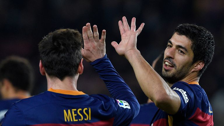 Lionel Messi and Luis Suarez celebrate