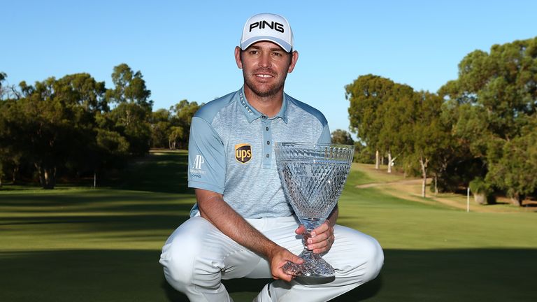 Louis Oosthuizen of South Africa poses with the trophy after winning the 2016 Perth International 