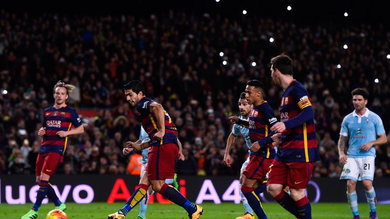 Luis Suarez (C) of FC Barcelona scores his team's fourth goal after being assisted by Lionel Messi from the penalty spot 