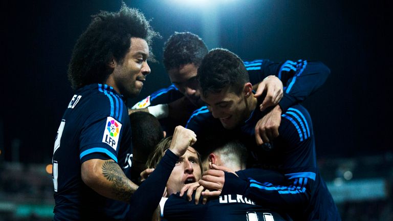 Luka Modric celebrates his winner for Real Madrid against Granada.