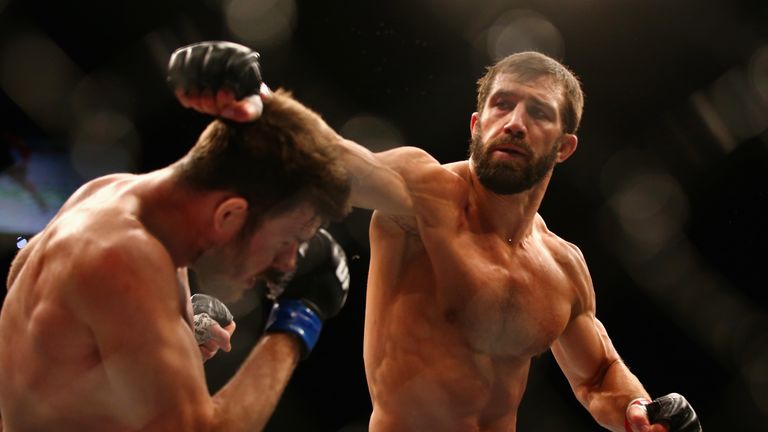Michael Bisping of England ducks a punch from Luke Rockhold of the USA in their middleweight fight during the UFC Fight N