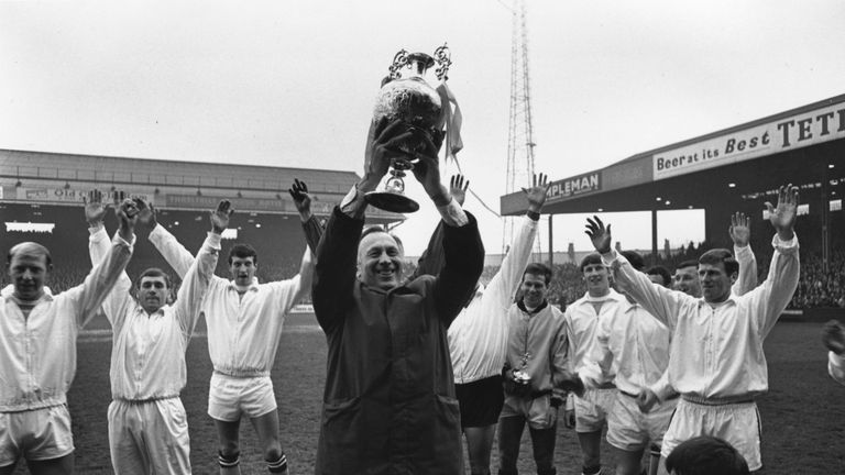 16th May 1968:  Manchester City manager Joe Mercer holds the League Championship trophy aloft after an exhibition match against Bury at Maine Road