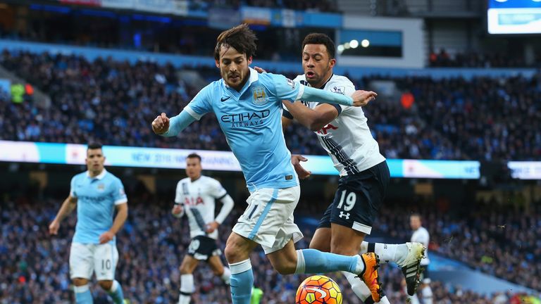 David Silva and Mousa Dembele compete for the ball