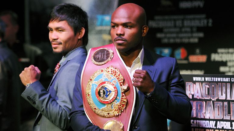 Manny Pacquiao (L) and Timothy Bradley stand for photos during the press conference to promote their upcoming WBO welterweight 