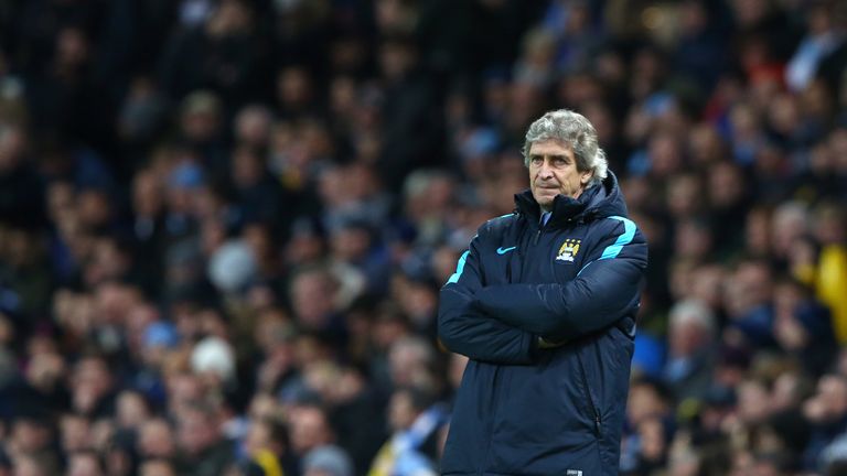 Manuel Pellegrini the manager of Manchester City looks on