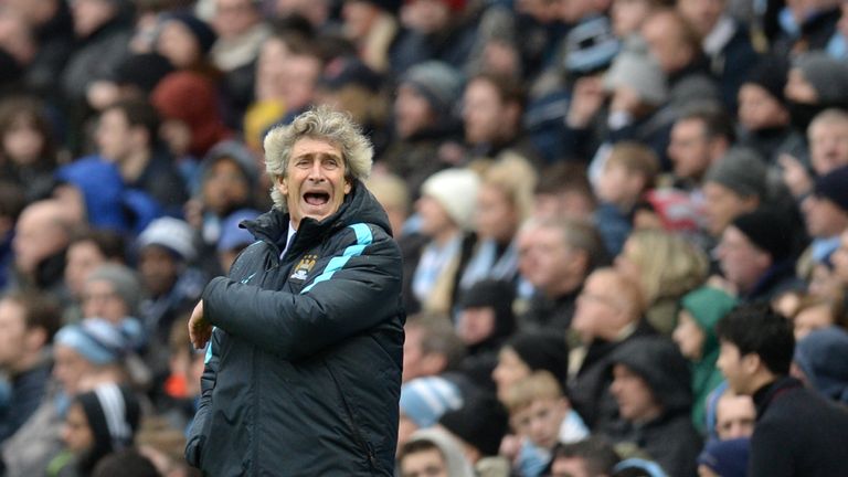 Manchester City's manager Manuel Pellegrini shouts instructions