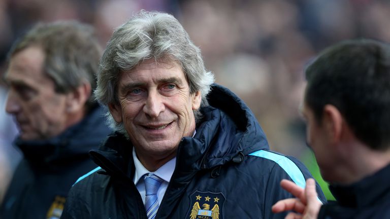 Manchester City manager Manuel Pellegrini with Aston Villa's manager Remi Garde, during the Emirates FA Cup, fourth round match at Villa Park, Birmingham. 