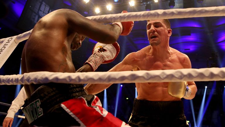 Marco Huck has Ola Afolabi on the ropes during their IBO cruiserweight title fight in Halle