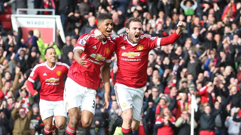 Marcus Rashford (L) celebrates with Juan Mata after opening the scoring for Manchester United against Arsenal