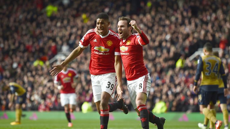MANCHESTER, ENGLAND - FEBRUARY 28: Marcus Rashford of Manchester United celebrates scoring his opening goal with Juan Mata (R) during the Barclays Premier 