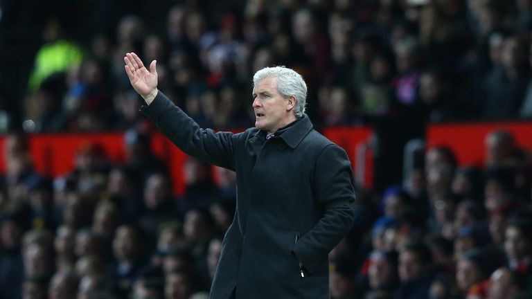 MANCHESTER, ENGLAND - FEBRUARY 02: Mark Hughes manager of Stoke City gestures during the Barclays Premier League match between Manchester United and Stoke 