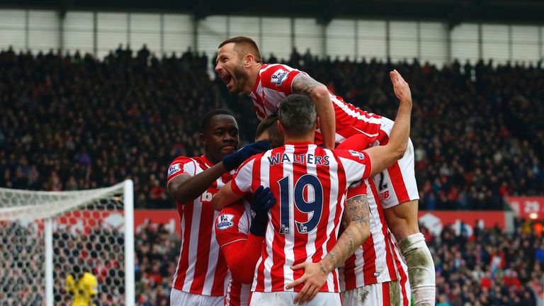 Stoke City's striker Marko Arnautovic (C) celebrates with teammates after scoring his second goal during the match against Aston Villa