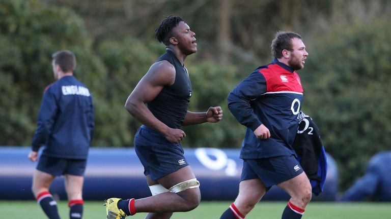 Maro Itoje (L) runs with Matt Mullan during an England training session 