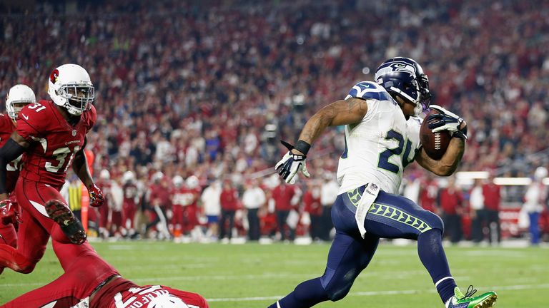 Running back Marshawn Lynch #24 of the Seattle Seahawks rushes the football to score a 79 yard touchdown against the Arizona C