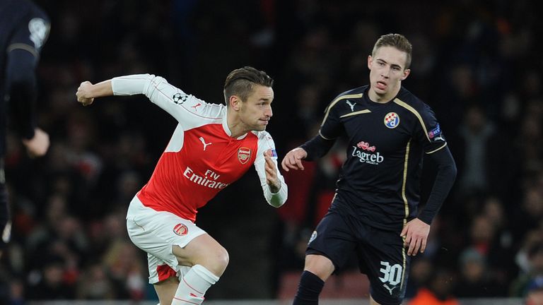 Mathieu Debuchy of Arsenal takes on Marko Rog of Zagreb