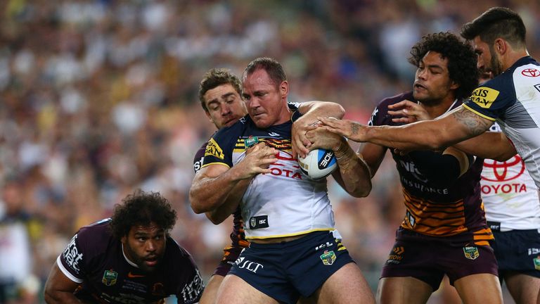 Matthew Scott of the Cowboys is tackled during the 2015 NRL Grand Final match between the Brisbane Broncos and the North Queensland Cowboys