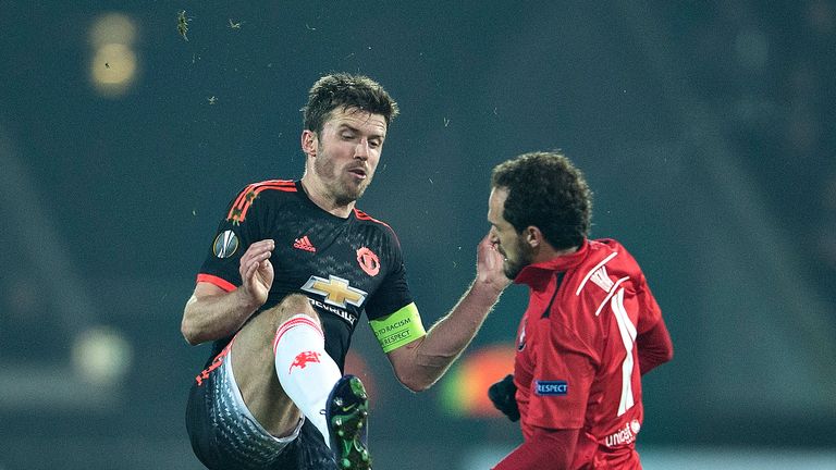 Manchester United's captain Michael Carrick vies with FCMs Marco Urena during the UEFA Europa League Round 