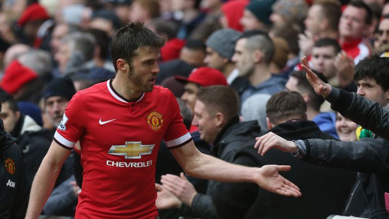 Michael Carrick walks off the Old Trafford pitch. 